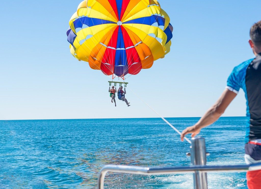 Couple parasailing in summer