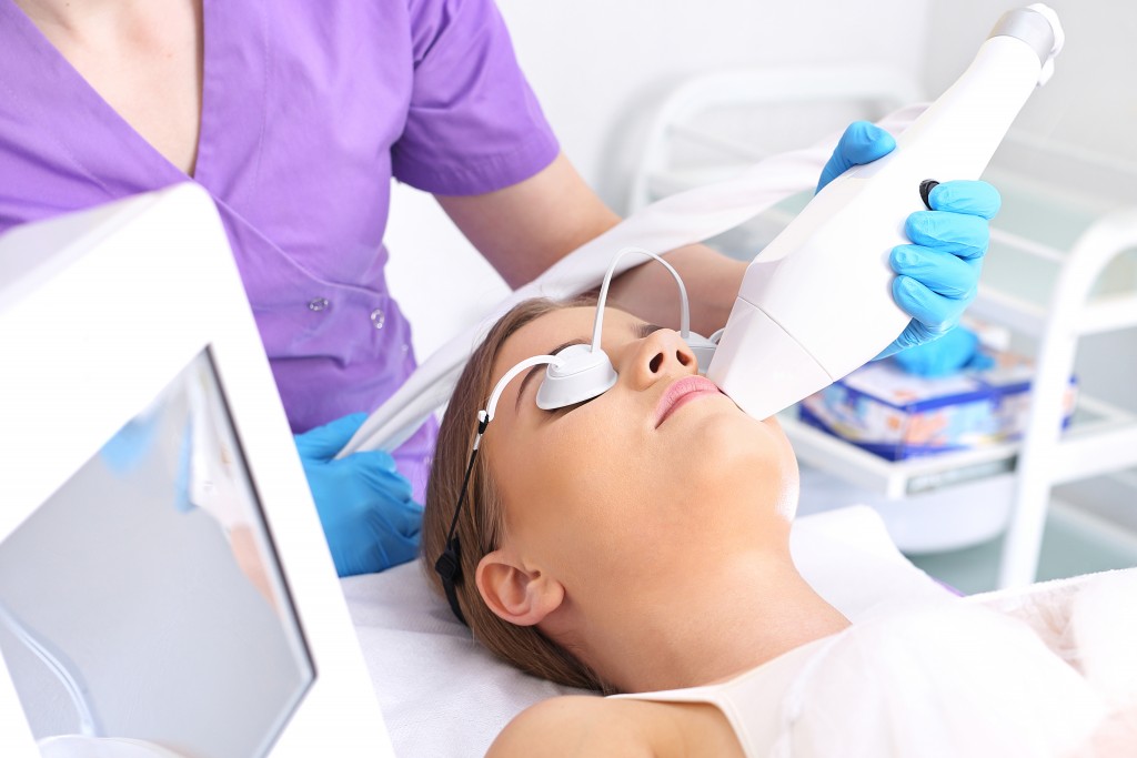 Woman having a laser hair removal treatment