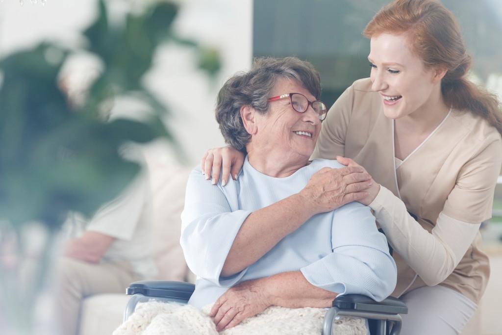Elderly woman with her nurse
