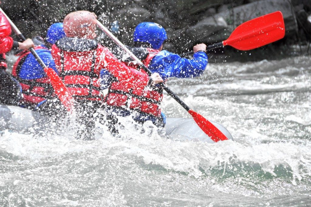 group of people doing white water rafting
