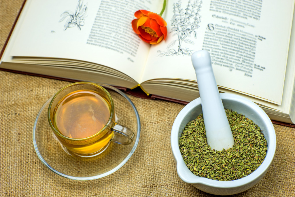 A tea, herbs, and a book