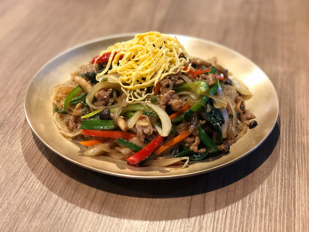 Stir-fried Korean glass noodles with vegetable. 