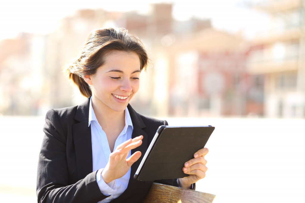 A woman using a digital tablet